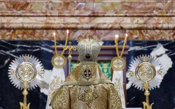 Melkite Catholic Patriarch Joseph Absi stands at the Altar of the Chair in St. Peter's Basilica for the celebration of a Byzantine Divine Liturgy as part of the assembly of the Synod of Bishops at the Vatican Oct. 9. (CNS/Lola Gomez)
