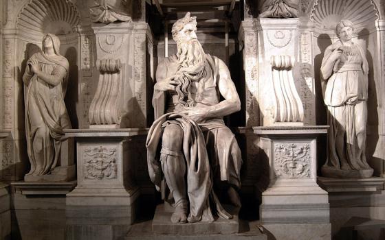 Biblical figures surround the marble statue of Moses, Michelangelo's masterpiece at the Church of St. Peter in Chains in Rome. The famous sculpture, originally planned as part of Pope Julius II's tomb inside St. Peter's Basilica, was completed in 1545 at the church. (CNS photo from Catholic Press Photo) 