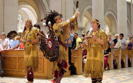 Members of the Huron-Wendat Nation perform a purification ritual at the Basilica of Sainte-Anne-de-Beaupré in Quebec June 26, 2016. (CNS/Presence/Philippe Vaillancourt)