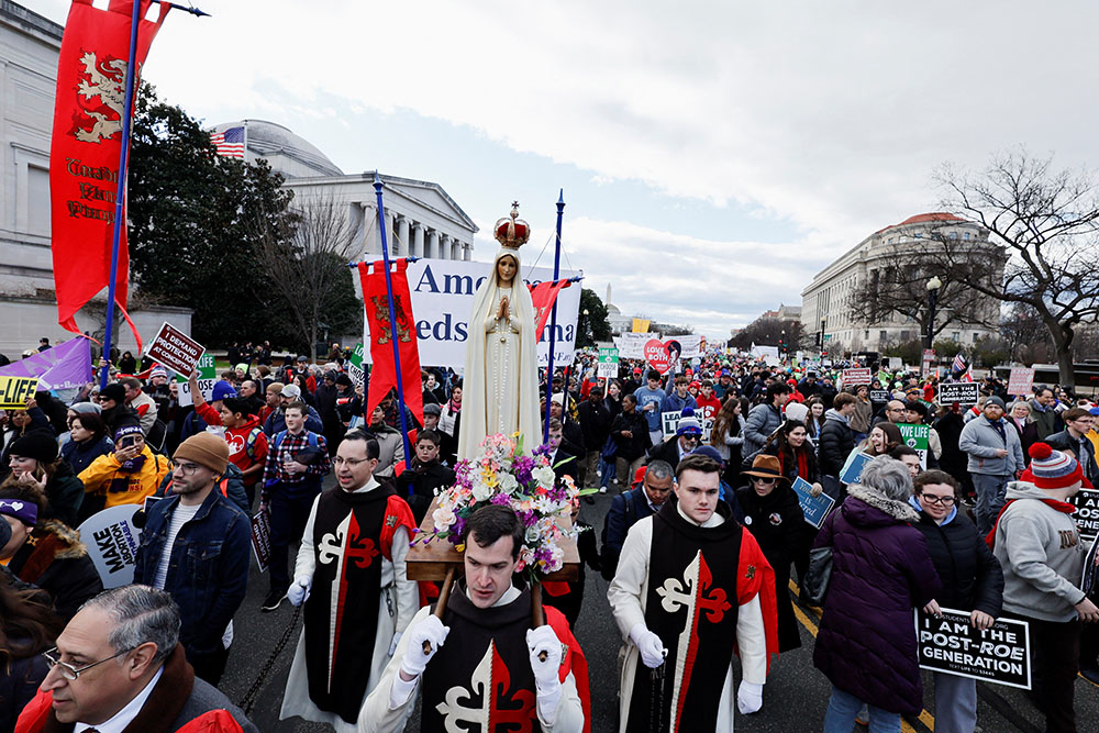 Pro-life demonstrators carry a statue of Mary past the U.S. Supreme Court during the annual March for Life in Washington Jan. 20, 2023. It was the first time the march was held since the high court overturned its 1973 Roe v. Wade abortion decision June 24, 2022. (OSV News/Reuters/Jonathan Ernst)