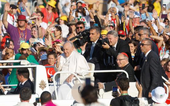 Pope Francis, accompanied by Cardinal Manuel Clemente of Lisbon, Portugal, arrives at Tejo Park in Lisbon for the closing World Youth Day Mass Aug. 6, 2023. (CNS photo/Lola Gomez)