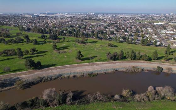 The Walker Slough, an offshoot of the San Joaquin River, is seen running alongside Van Buskirk Park in Stockton, Calif., Jan 26, 2023. Environmental groups hope the former municipal golf course will be converted into a restored floodplain. (OSV News/Reuters/Nathan Frandino)