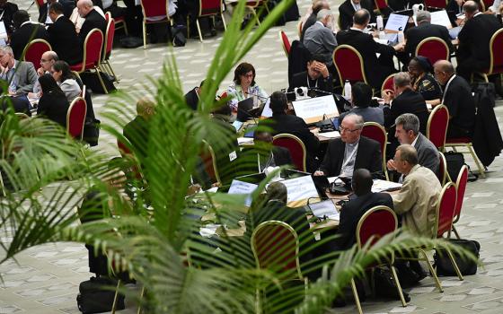 Members of the assembly of the Synod of Bishops, organized into 35 groups based on language, begin their small-group discussions Oct. 5 in the Paul VI Audience Hall at the Vatican. (CNS/Vatican Media)