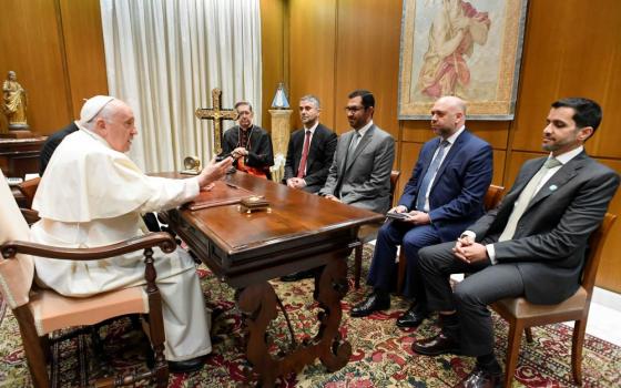Pope Francis meets Sultan al-Jaber, the president-designate of the 2023 United Nations Climate Change Conference, known as COP28, his delegation and Cardinal Miguel Ángel Ayuso Guixot, prefect of the Dicastery for Interreligious Dialogue, at the Vatican Oct. 11, 2023. COP28 is set to open Nov. 30 in Dubai. (CNS/Vatican Media)