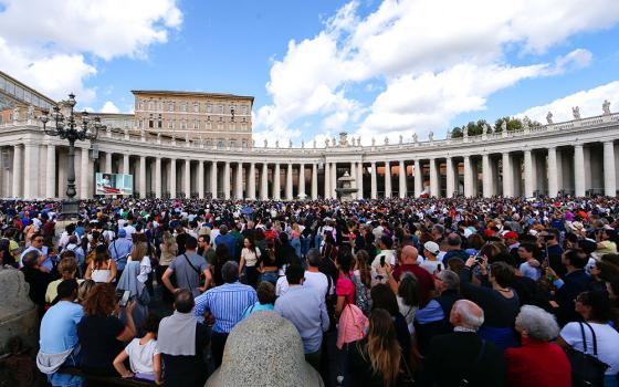 Visitors gather in St. Peter's Square at the Vatican to pray the Angelus with Pope Francis Oct. 29. (CNS/Lola Gomez)