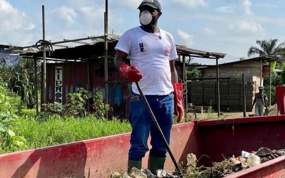 Fr. Innocent Wefon of Cameroon participates in a cleaning exercise with the Catholic Youth Network for Environmental Sustainability Africa, a grassroots lay organization that aims to empower African youth to get involved in working for a better climate. 