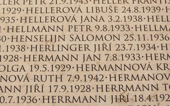 At a museum in Terezín, Czech Republic, a wall bearing names of child victims who were deported from the ghetto to death camps includes the name Jiří Herlinger. (NCR photo/Chris Herlinger)