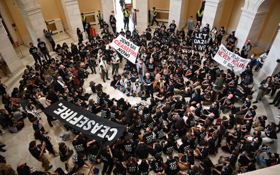 Hundreds of demonstrators calling for a cease-fire in Gaza gathered in the U.S. Capitol's Cannon House Office Building rotunda on Oct. 18. The group was primarily organized by Jewish Voice for Peace. (RNS/Jack Jenkins)