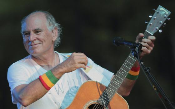 Jimmy Buffett performs at his sister's restaurant in Gulf Shores, Alabama, on June 30, 2010. (AP/Dave Martin, File)