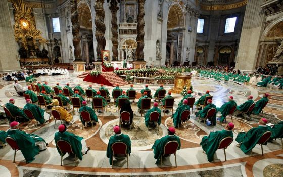 Bishops and cardinals are pictured as Pope Francis celebrates a Mass to open the process that will lead up to the assembly of the world Synod of Bishops in 2023, in St. Peter's Basilica at the Vatican in this Oct. 10, 2021, file photo.