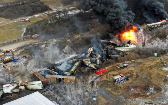 This photo taken with a drone shows portions of a Norfolk Southern freight train that derailed Feb. 3, 2023, in East Palestine, Ohio, still on fire at midday the next day. (AP Photo/Gene J. Puskar)