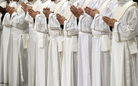 Newly ordained priests pray during a ceremony led by Pope Francis in St. Peter’s Basilica at the Vatican on May 12, 2019. (RNS/AP/Alessandra Tarantino)