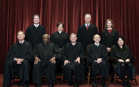 Members of the Supreme Court pose for a group photo at the Supreme Court in Washington, April 23, 2021.