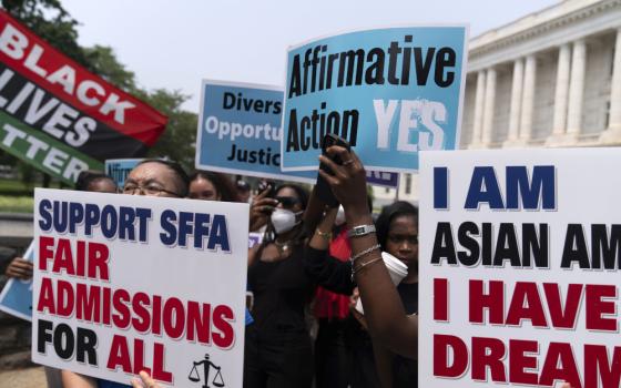 Demonstrators protest outside of the Supreme Court in Washington June 29, after the Supreme Court struck down affirmative action in college admissions, saying race cannot be a factor. (AP/Jose Luis Magana)
